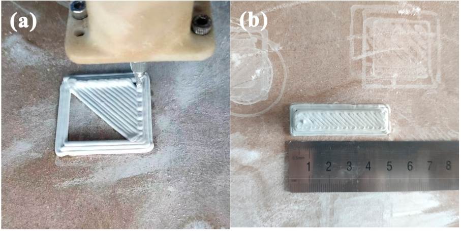 Extrusion printing of ceramic green bodies. (a) Ceramic green body being printed; (b) Printed ceramic green body.